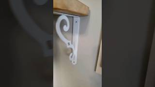 Wood vanity tray from JoAnn turned into a wall shelf with Walmart shelf brackets.