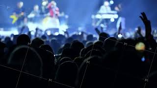 Crowd enjoying music concert, silhouettes dancing at live band performance on stage