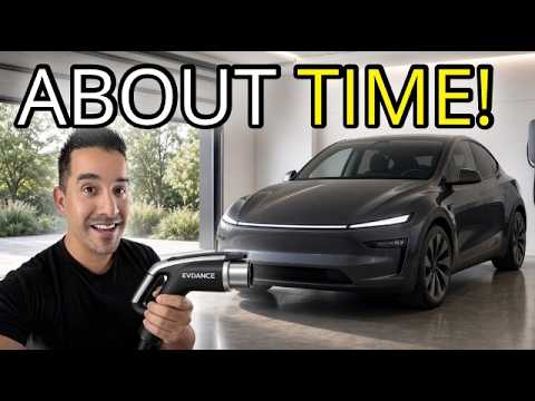 Matt holding the EVDance Flux Pro NACS charger handle in front of a Model Y