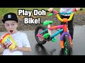 Riding a Play Doh bike?!