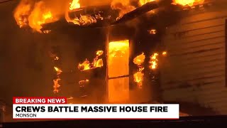 Crews battle massive house fire in Monson