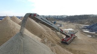 LF520 Low Feeder stockpiling sand