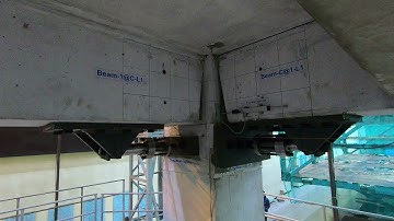 Low-damage concrete building earthquake test: Slotted beam column joint