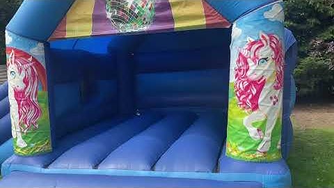Unicorn Disco Bounce & Slide bouncy castle with built in Bluetooth speaker and disco light