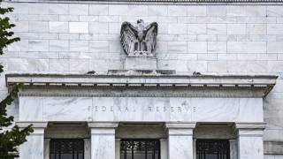 Fed keeps interest rates steady as gas prices and living costs continue to rise