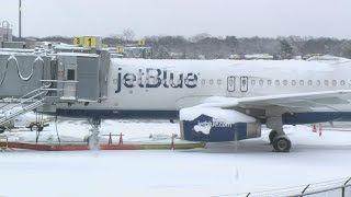 Some winter-weary travelers delayed at Bradley as snow scrubs flights across the Northeast