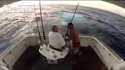 Big Fish Jumps Into Boat And Man Jumps Out