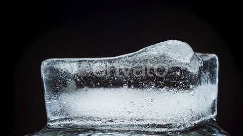 Ice Melts and Rotates on a Black Background | Stock Footage - Envato elements