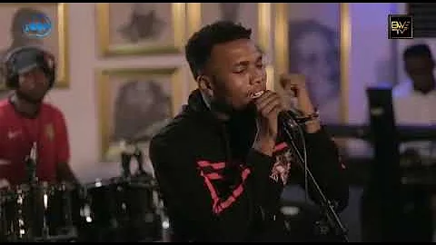 Victor AD performing his hit song with a live Band.