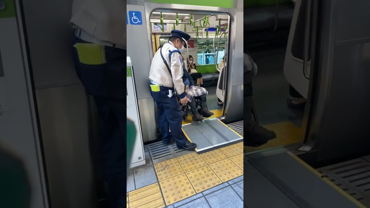 Japan train station disabilities rights and station man manners with an old man with a chair help