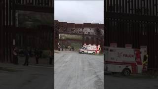 At least 10 migrants were injured after falling from the U.S.-Mexico border wall on Saturday.