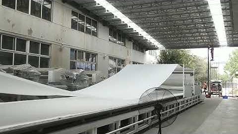 How to spread Fabric from 1000kgs fabric rolls to 20m length layers?