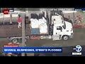 High tides flood Newport Beach streets and businesses