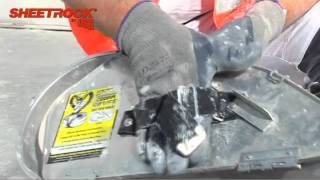 Using a "Banjo" drywall taping machine
