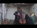 Cellist Plays In Ruins Of City