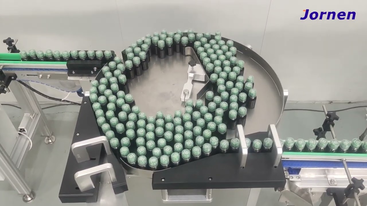 Bottle cartoning - place the measuring cup on the bottle cap