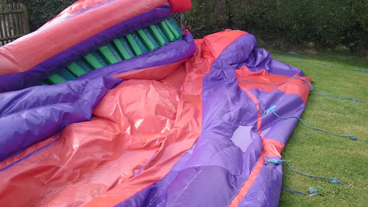 Removing water from bouncy castle slide