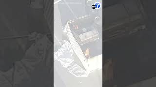 Semi-truck carrying lithium-ion batteries overturns, sparks fire in San Pedro