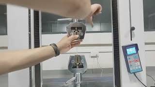 Computer controlled universal tension and pressure testing machine