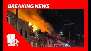 Neighbors evacuate amid rowhome fire in Canton