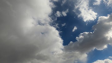 Meditation video, clouds in 4k. Time-lapse of the clouds in the sky. From sunny day to snow storm.