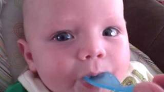 Gavin eating rice cereal for the first time.