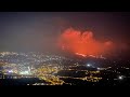 I experienced an earthquake while recording this video. The sky over the volcano is orange red.