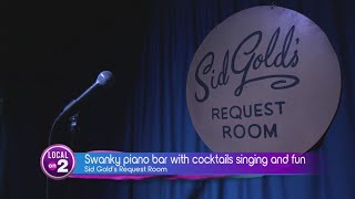 A swanky piano bar with cocktails and singing and fun