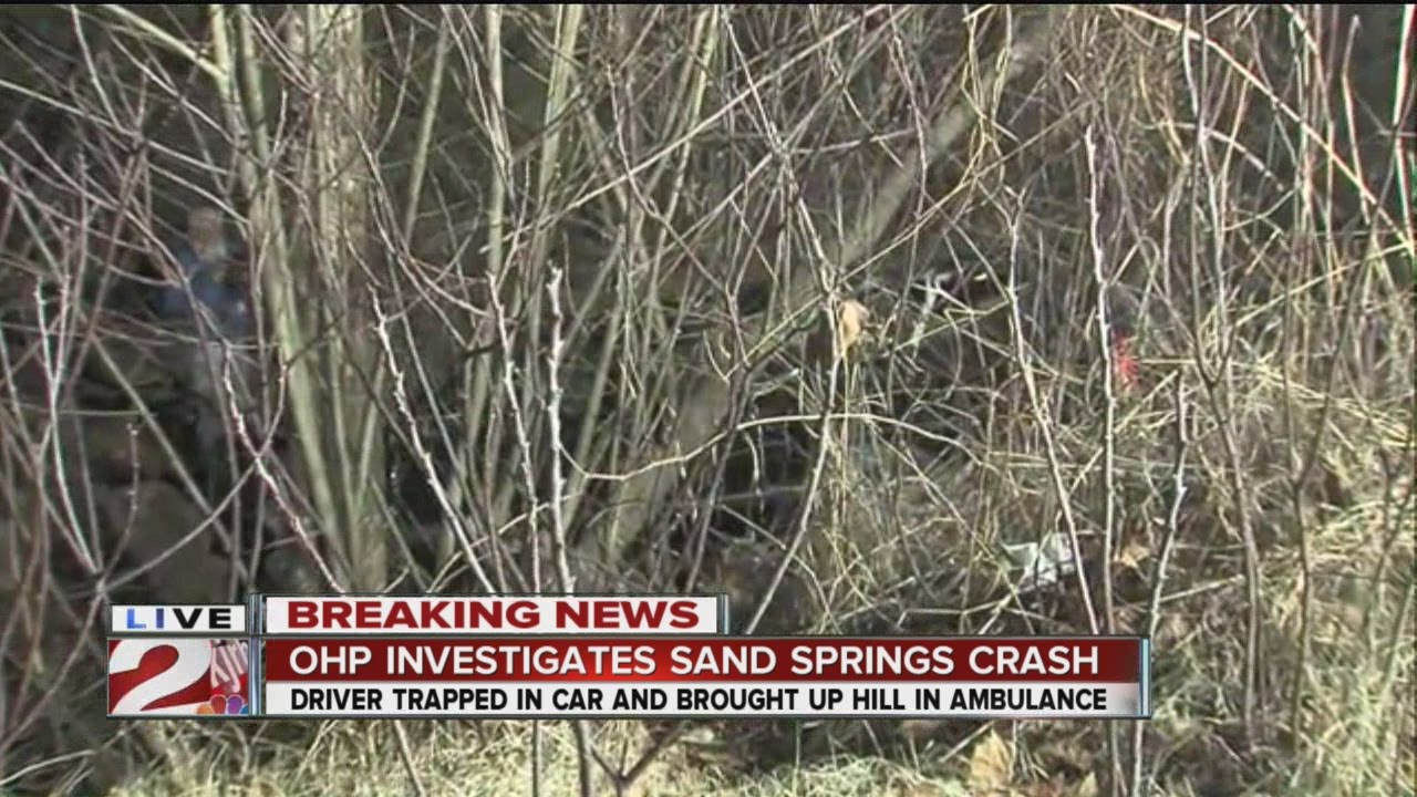 1 injured after car wrecks, falls into ravine on Avery Drive