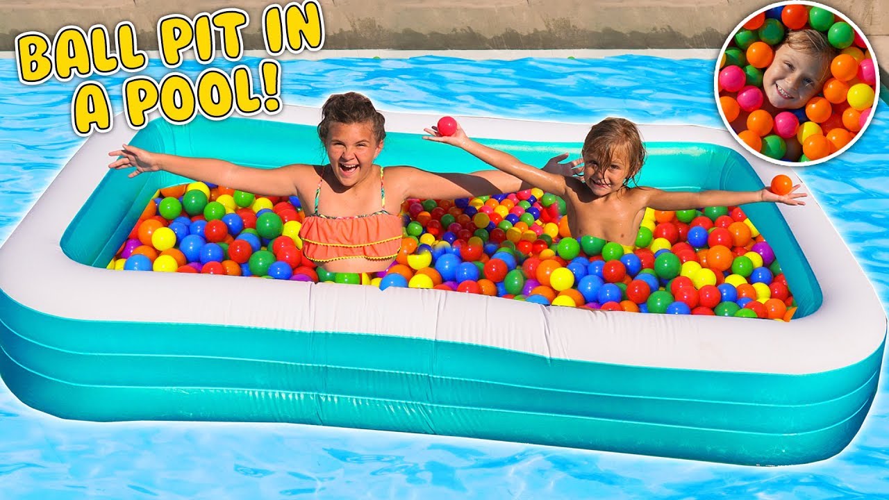 MASSIVE FLOATING INFLATABLE BALL PIT IN floating inflatable pool. 