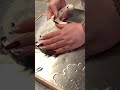 cutting agar agar using a knife into several small pieces which will be mixed into a drink