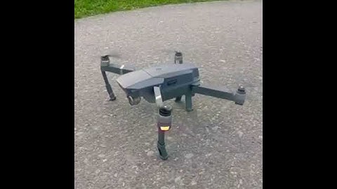 DJI Mavic drone starting up with propellers folded! Slow motion