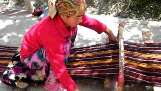 young carpet weaver in a remote Tajik mountain village