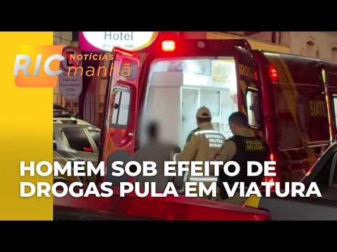 Man under the influence of drugs jumps onto police cruiser in downtown Curitiba