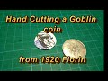 Hand cutting a Goblin coin from 1920 florin