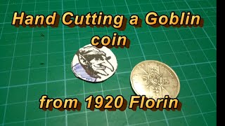 Hand cutting a Goblin coin from 1920 florin