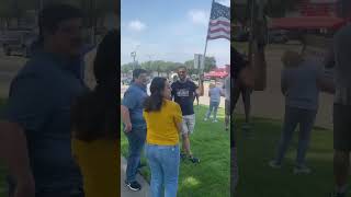 Over 100 protesters gathered with American flags and signs in Frisco Texas