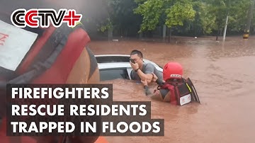 Firefighters Rescue Residents Trapped in Floods