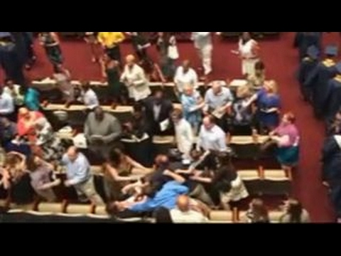 Brawl breaks out at high school graduation ceremony - YouTube