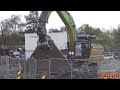 4k cat 336 removing concrete with grapple