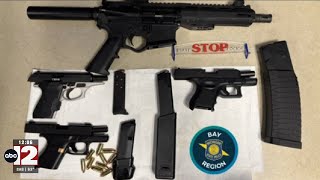 Mother, son arrested after police find illegal weapons in Saginaw