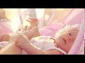 mother touching hand of baby daughter