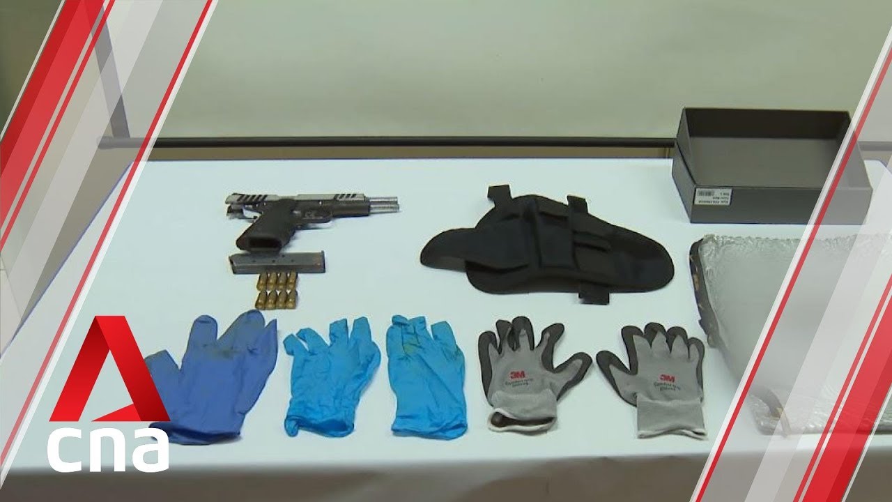 Two men arrested after loaded firearm found in raid - YouTube