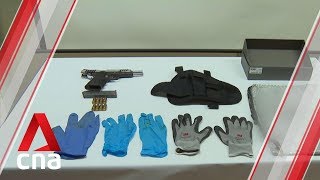 Two men arrested after loaded firearm found in raid