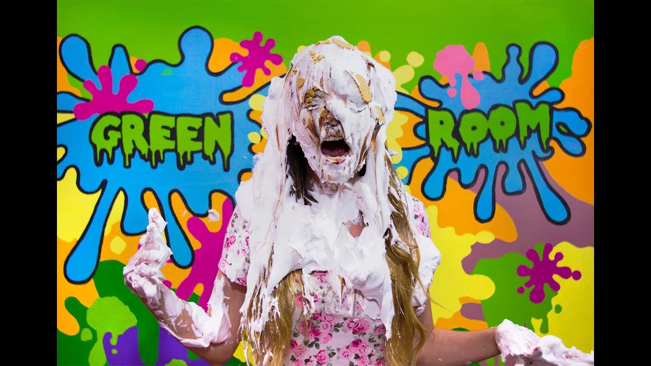 Andrea Gets Pied In The Face And Slimed - Mexican model Andrea getting many pies thrown at her face. She then gets gunged with chunky dark green slime.