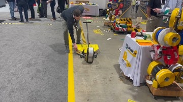New Mighty Liner Bot Prototype Video Demo at Promat Show. Mighty Liner floor tape applicator robot.