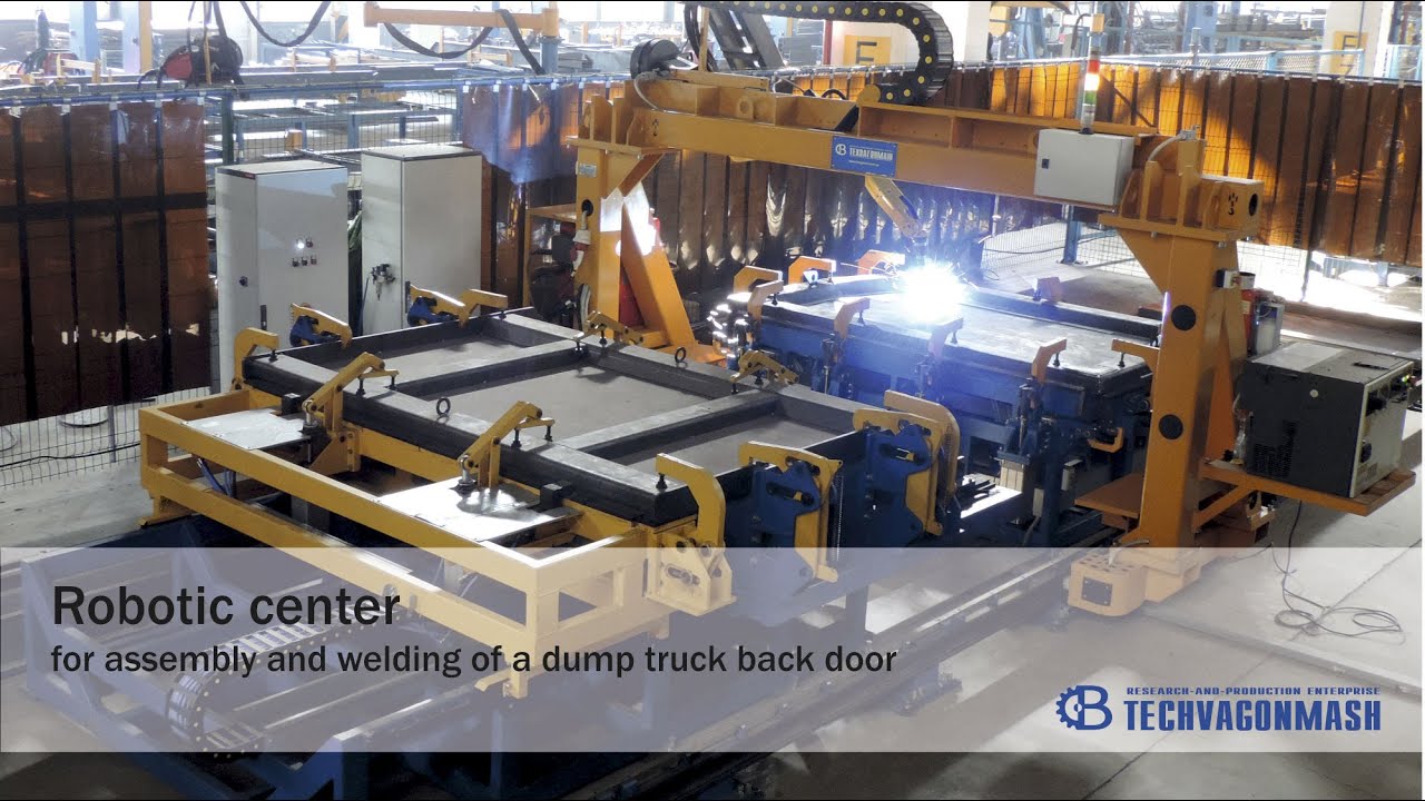 Robotic center for assembly and welding of a dump truck back door YouTube