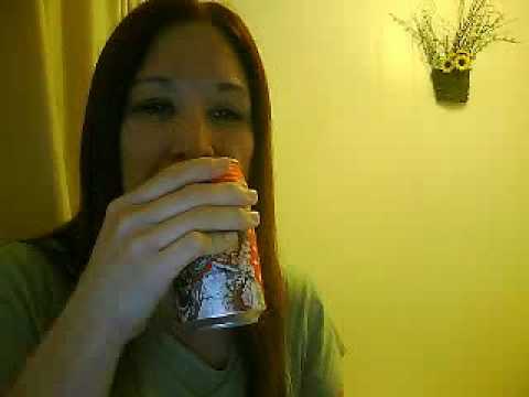 Woman burps after drinking a can of coke.