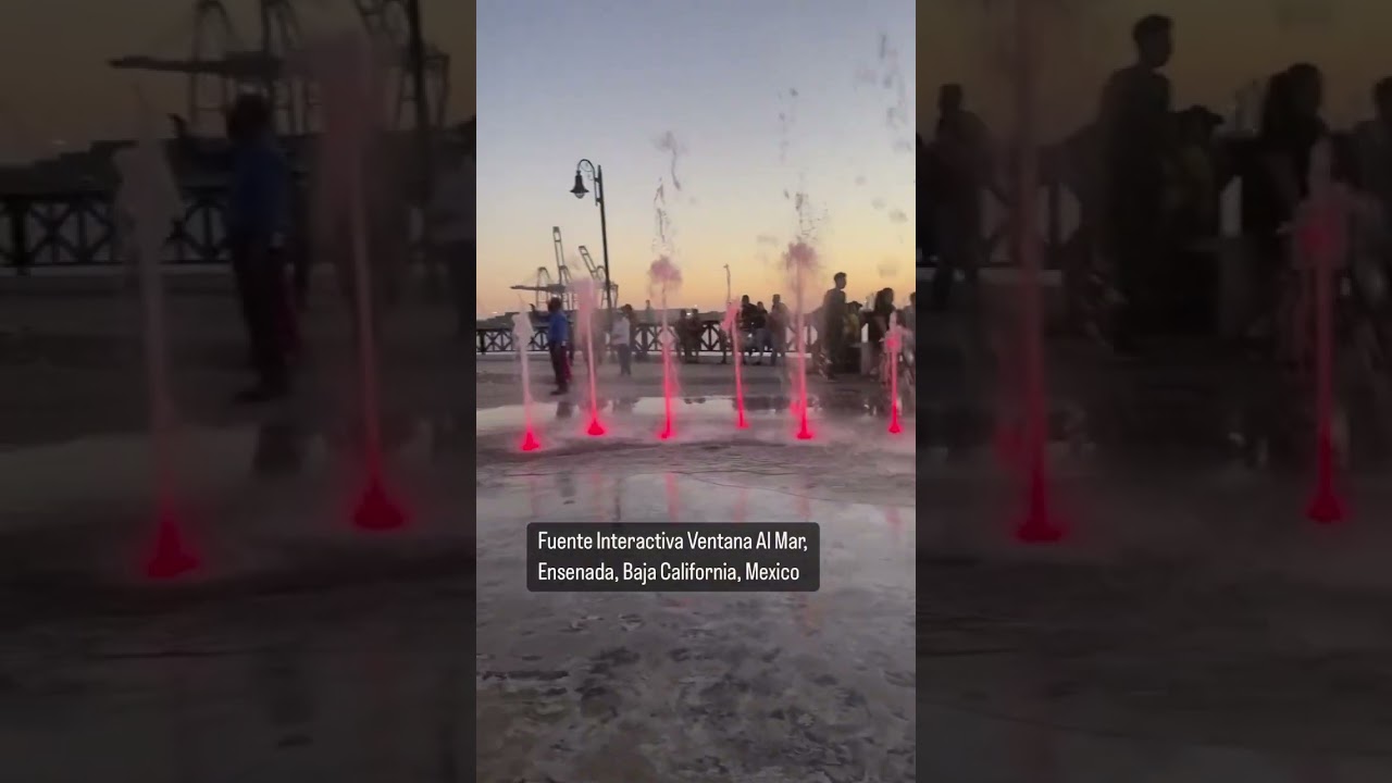 Running through a musical fountain in Ensenada, Mexico 