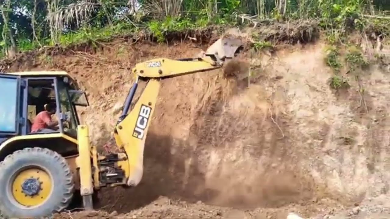 JCB3DX machine working village road 